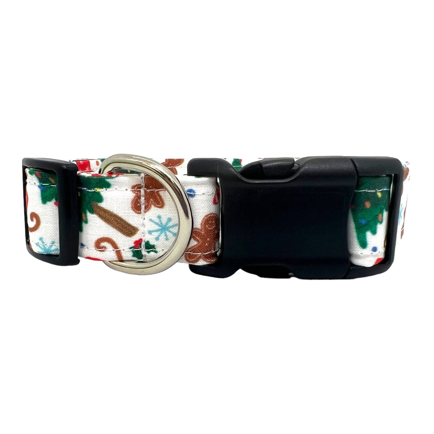 Festive dog collar featuring a pattern of Christmas trees, sleds, and gingerbread cookies.