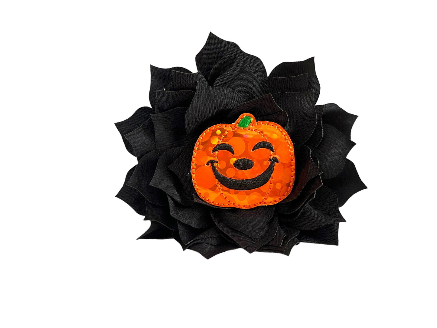Orange jack-o’-lantern dog collar flower with layered petals, shown with elastic loop for easy collar attachment.