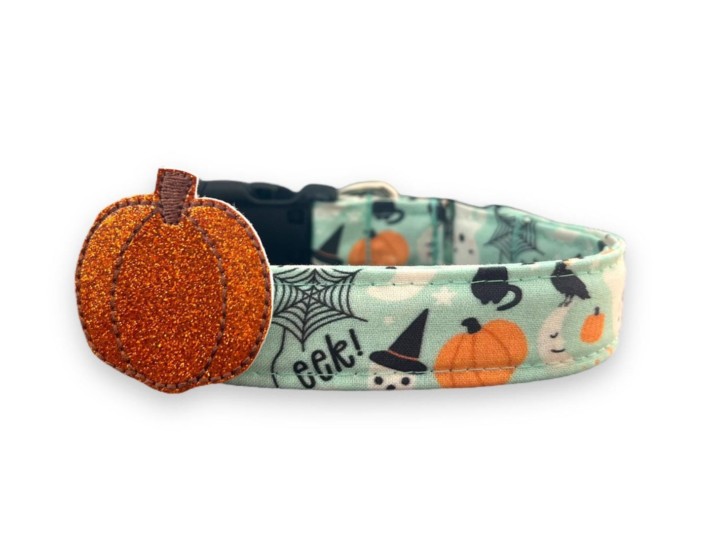 Halloween-themed dog collar with a pumpkin charm on a white background
