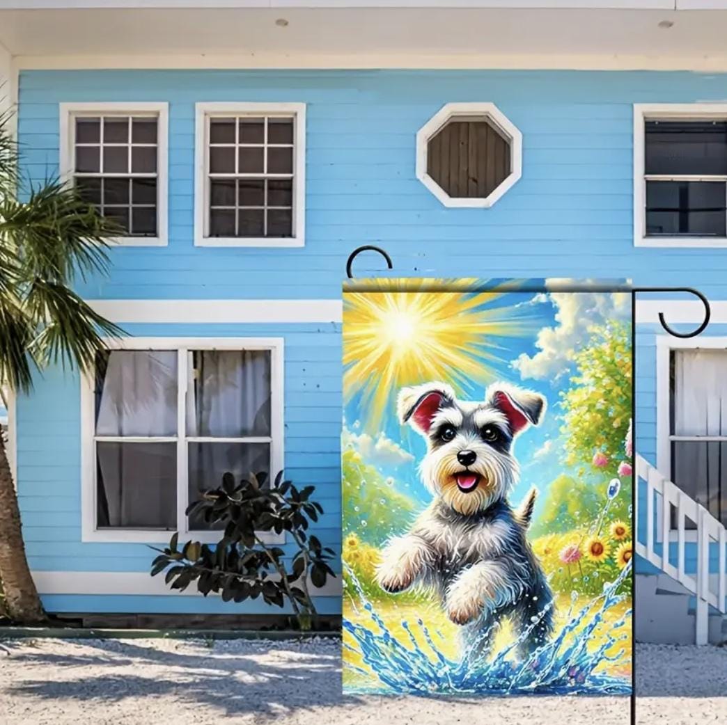 Schnauzer garden flag showing a happy Schnauzer splashing in a puddle on a sunny day, surrounded by colorful flowers in a vibrant outdoor scene.