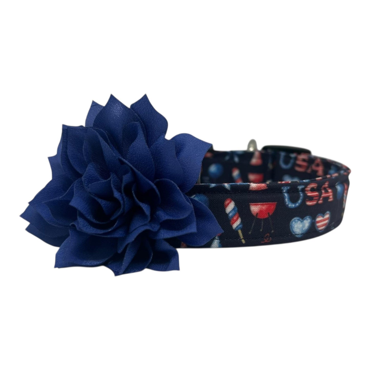 Navy blue 4th of July dog collar featuring red, white, and blue icons like popsicles, BBQ grills, fireworks, and balloons, paired with a detachable 3" or 4" flower in your choice of color.