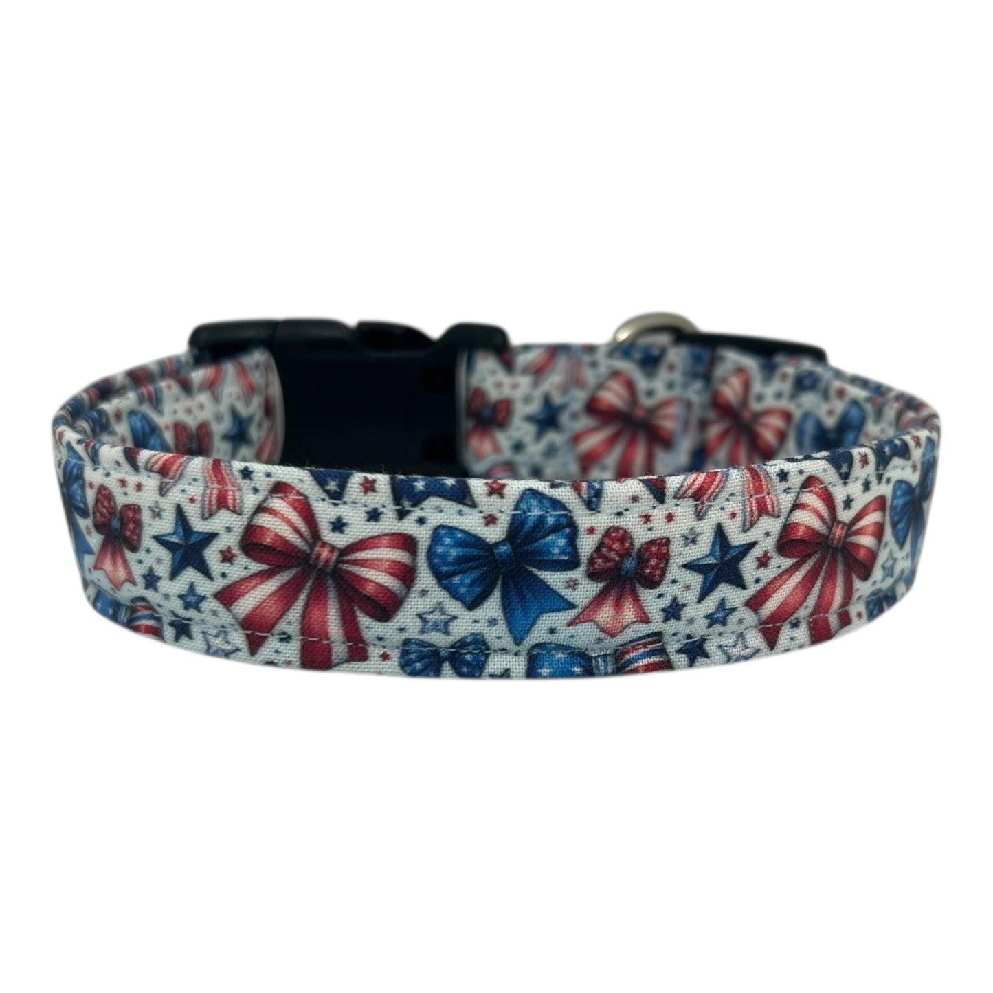 Patriotic dog collar with red, white, and blue bows and stars on a light background