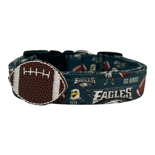 Philadelphia Eagles dog collar with team-themed print and brown football embellishment featuring stitched laces.