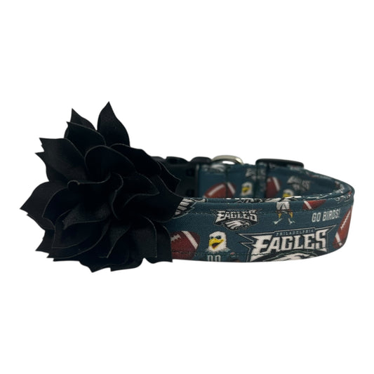 Philadelphia Eagles dog collar with dark green team print and a black flower embellishment attached.