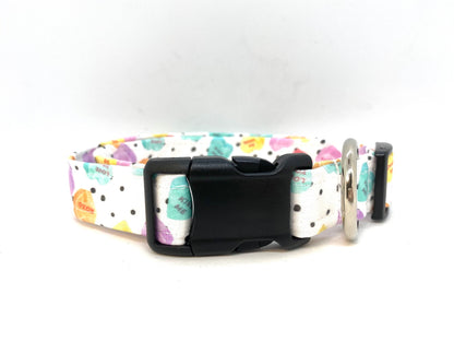 White Valentine’s Day dog collar with black polka dots, colorful conversation heart candy design