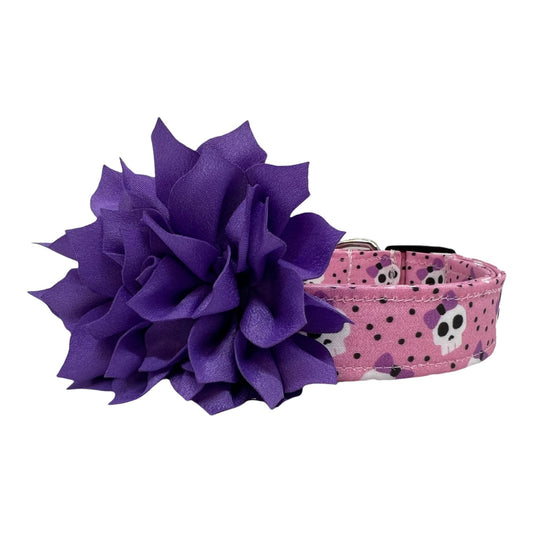Pink dog collar with lavender bow skulls and polka dots with a detachable 3-inch lavender flower embellishment.

