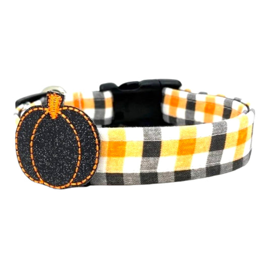Halloween plaid dog collar with pumpkin charm on a white background