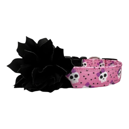 Pink dog collar with lavender bow skulls and a detachable black flower embellishment.
