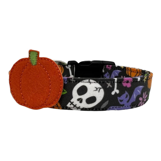 Halloween dog collar with skulls, bats, and pumpkins, featuring a removable felt pumpkin embellishment.