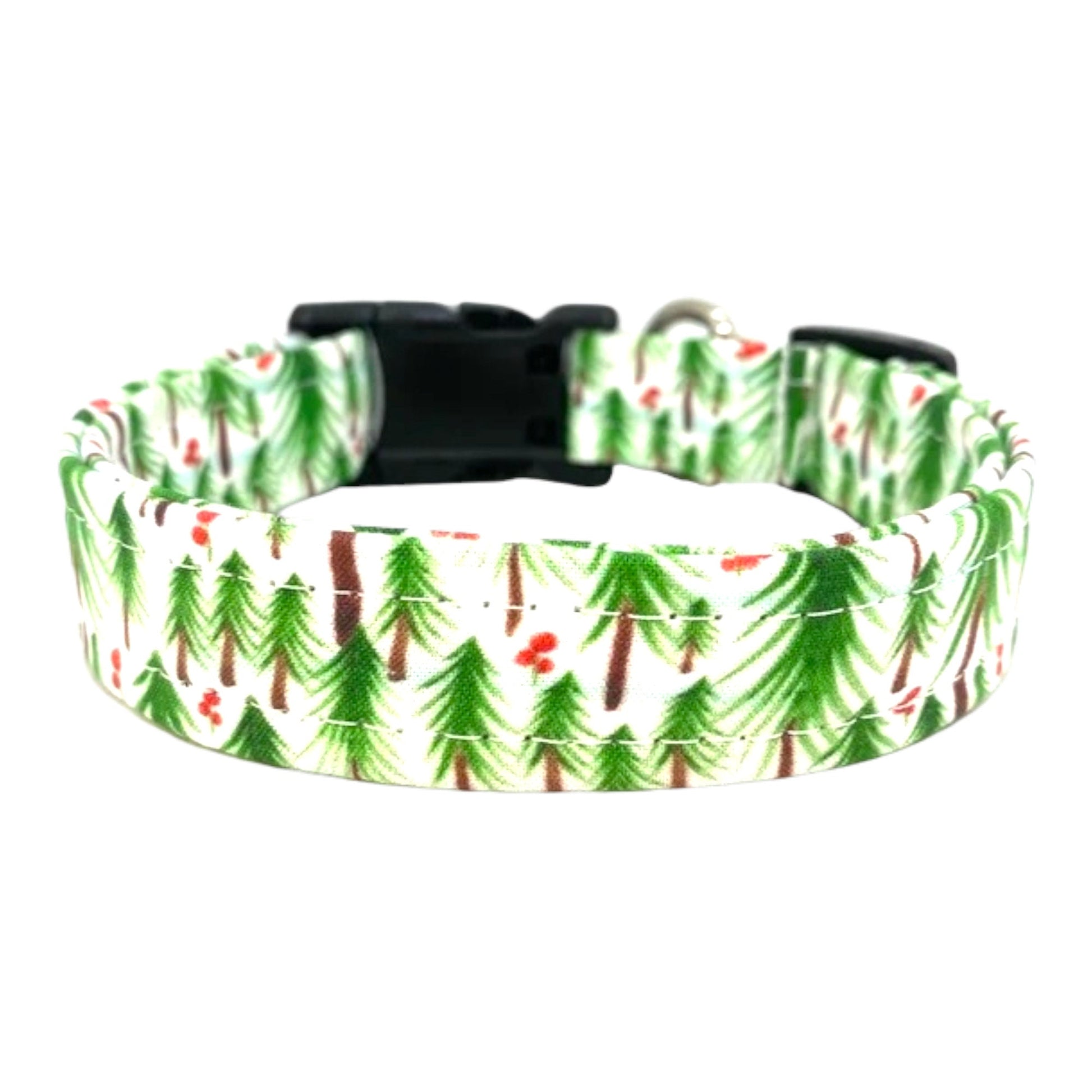 Side view of festive dog collar showing welded D-ring, contoured buckle, and Christmas tree shaker embellishment