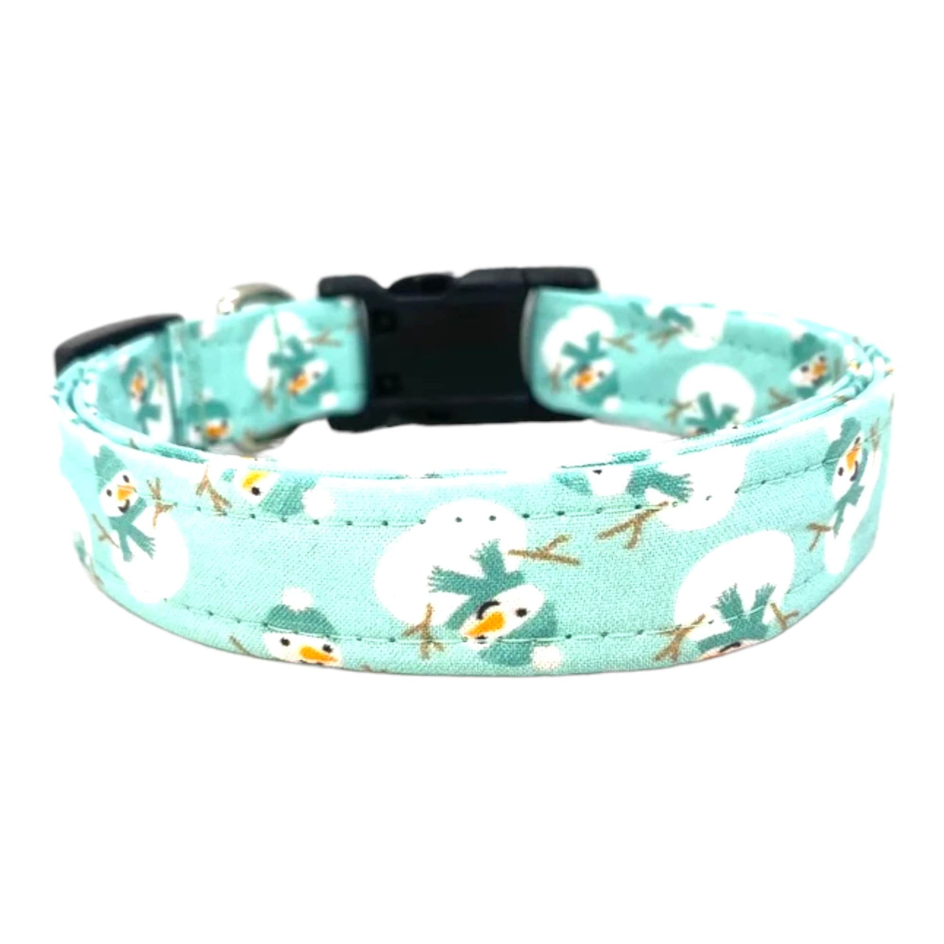 Light blue aqua dog collar decorated with scattered snowmen wearing aqua blue scarves, shown flat to highlight the festive winter pattern.