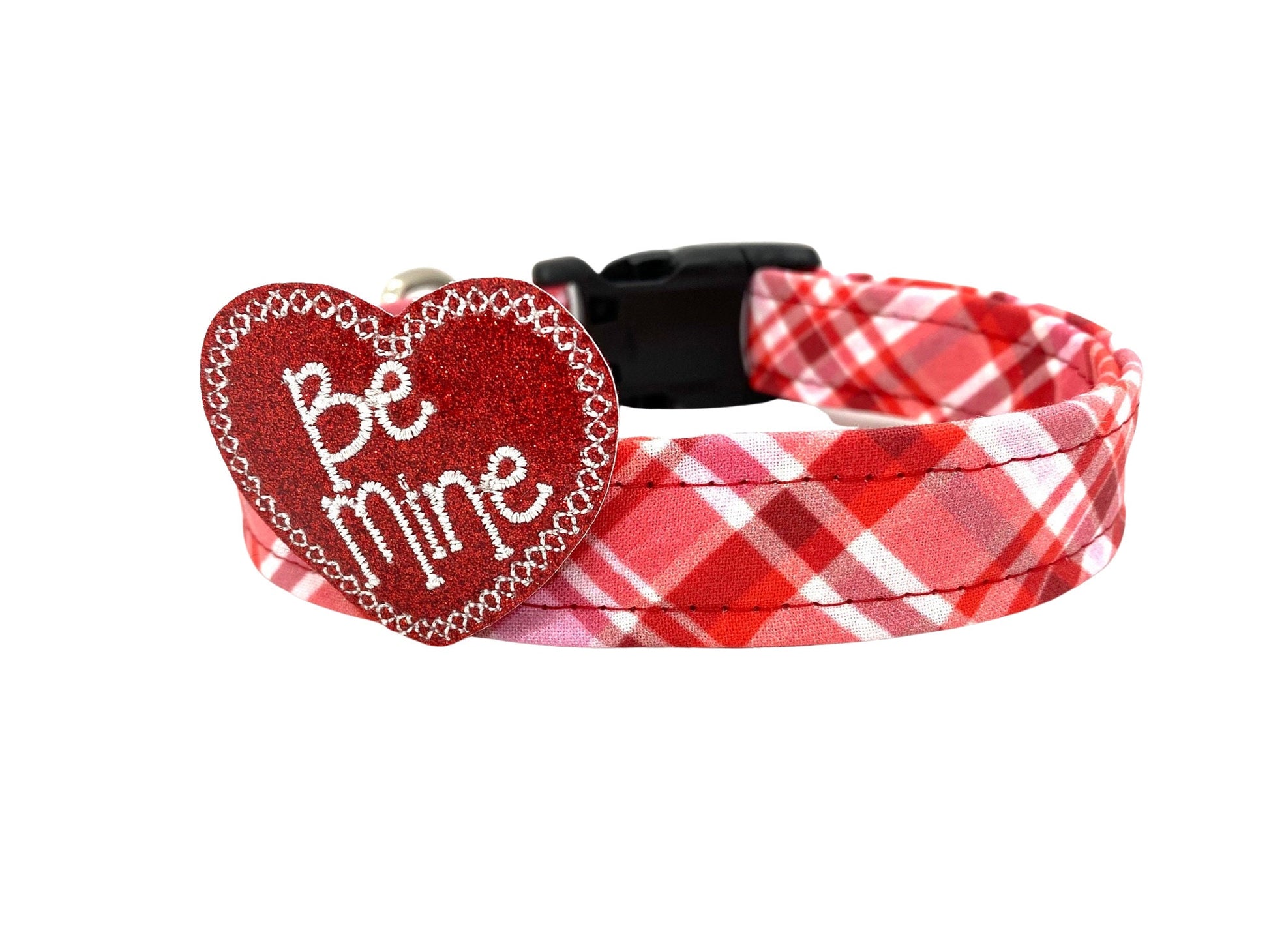 Red and white Valentine’s Day plaid dog collar with heart-shaped “Be Mine” embellishment.