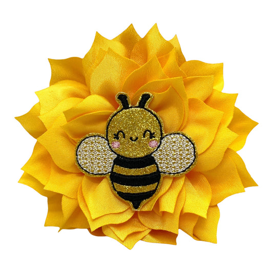 Golden yellow dog collar flower with sparkly bumble bee embellishment, shown in 4-inch size with layered petals and elastic loop attachment.