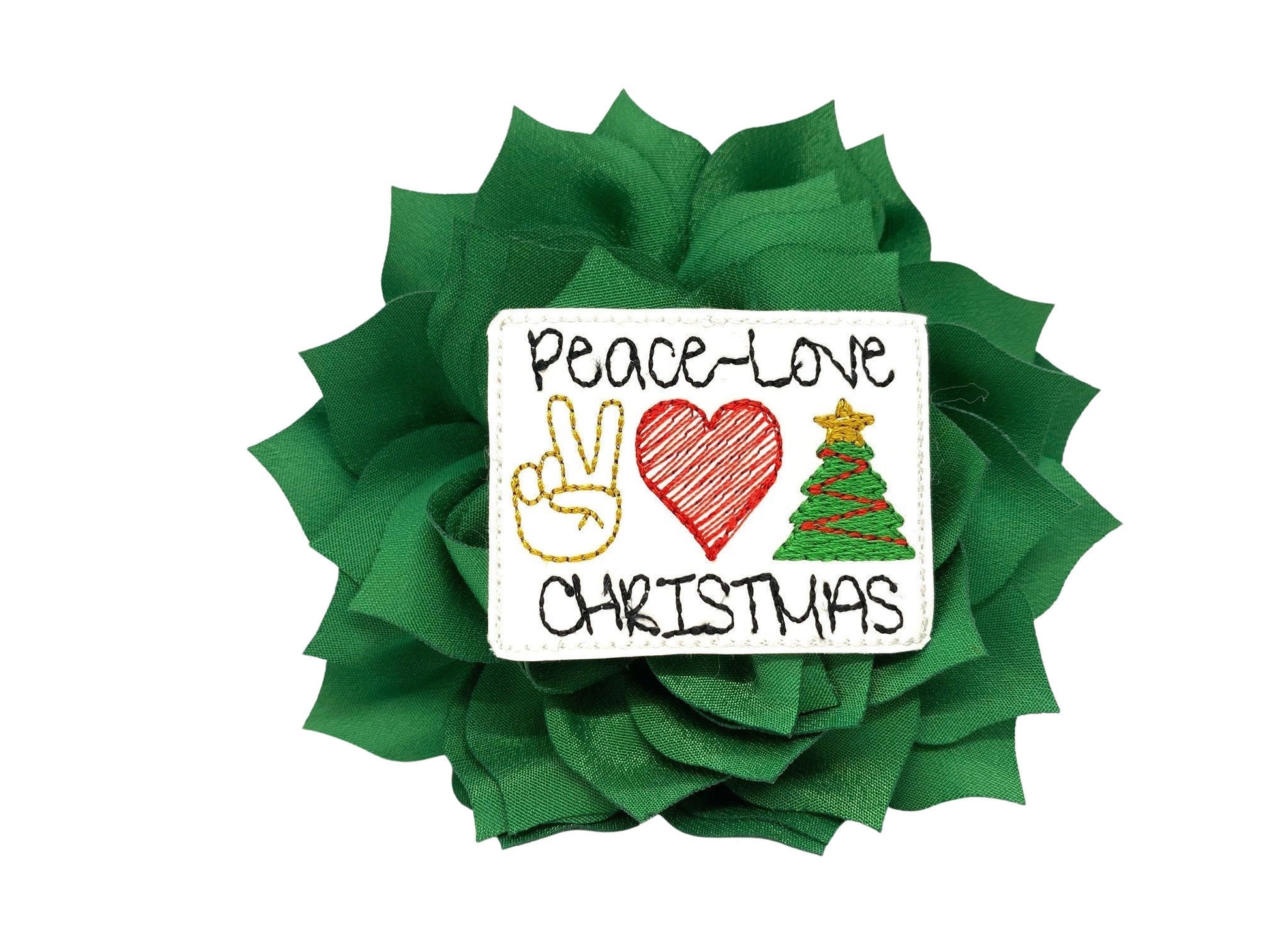 Emerald Green dog collar flower with layered petals and a “Peace, Love & Christmas” embellishment in the center, shown in a 4-inch flower.