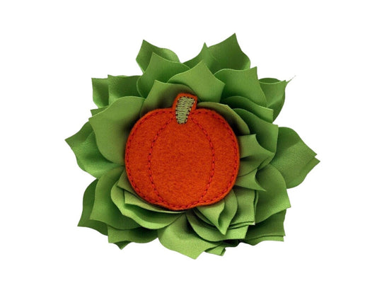 Orange felt pumpkin-embellished dog collar flower with layered petals, shown on a 4-inch apple green flower.