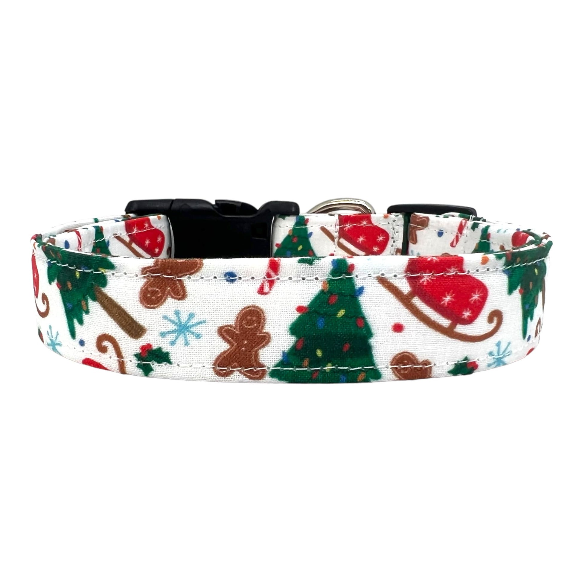 Festive dog collar featuring a pattern of Christmas trees, sleds, and gingerbread cookies.