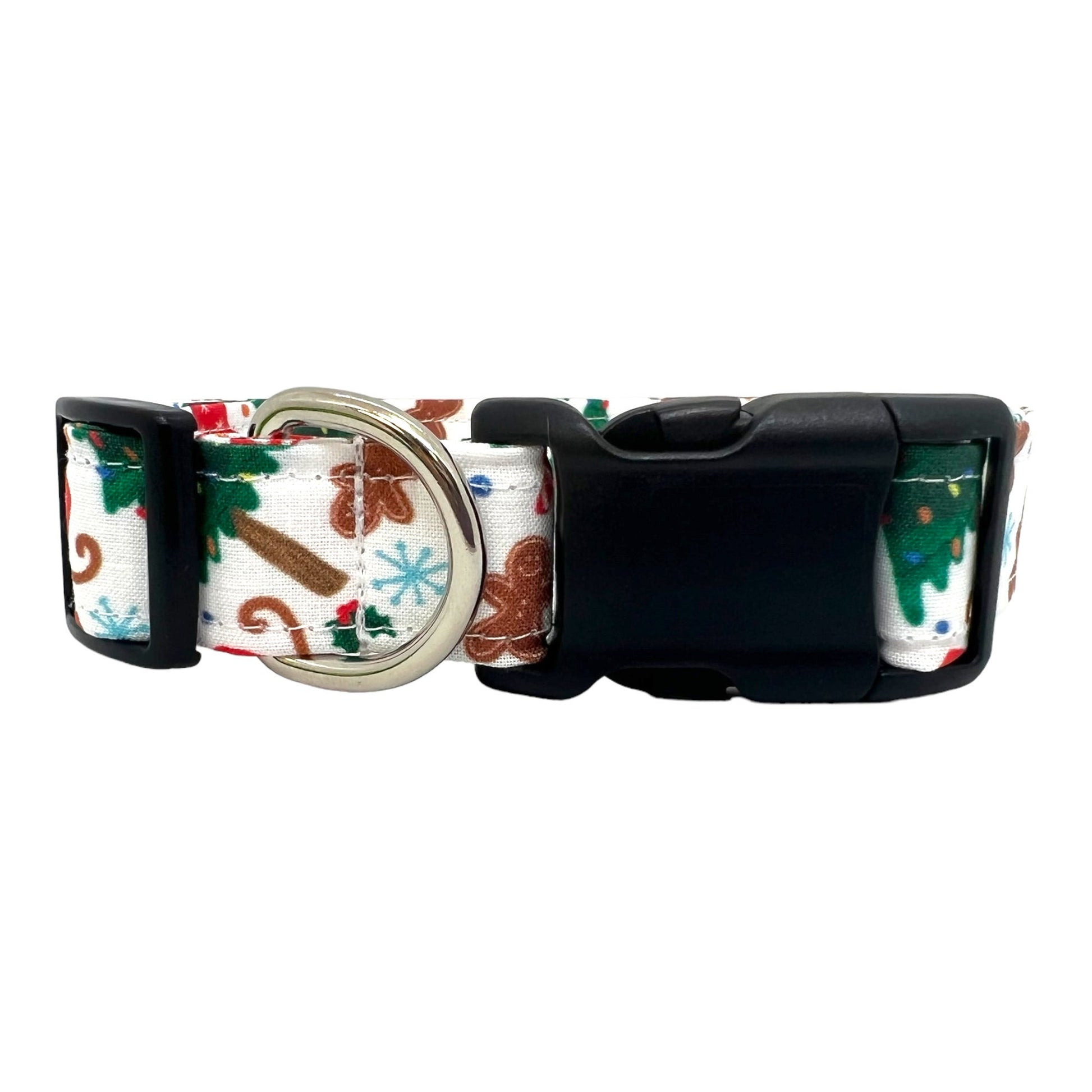 Festive dog collar featuring a pattern of Christmas trees, sleds, and gingerbread cookies.