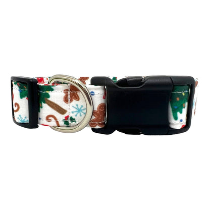 Festive dog collar featuring a pattern of Christmas trees, sleds, and gingerbread cookies.