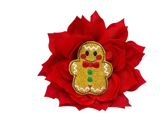 Red dog collar flower with layered petals and a sparkly gingerbread man embellishment in the center, shown in a 4-inch size with an elastic loop for easy attachment.