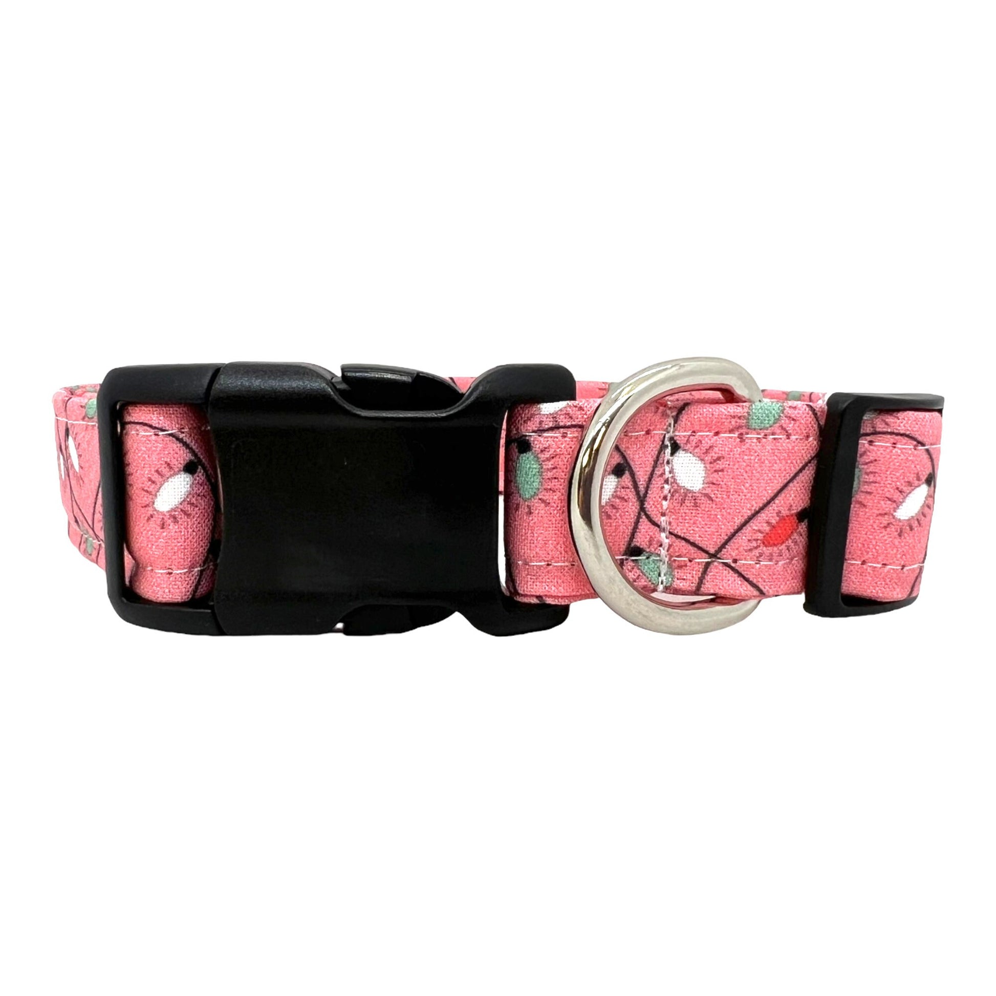 Pink dog collar decorated with a colorful string of Christmas lights, shown flat to highlight the festive holiday design.