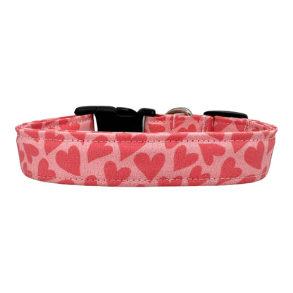 Dog collar with pink heart pattern on a white background
