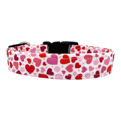 Valentine’s Day dog collar featuring red and pink hearts in various sizes, heart-themed pet collar shown flat.