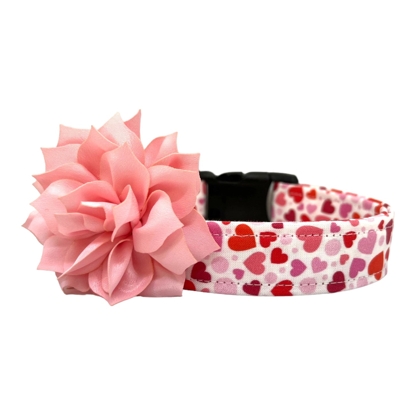 Valentine’s Day dog collar featuring red and pink hearts in various sizes, heart-themed pet collar shown flat, shown with removable light pink dog collar flower.