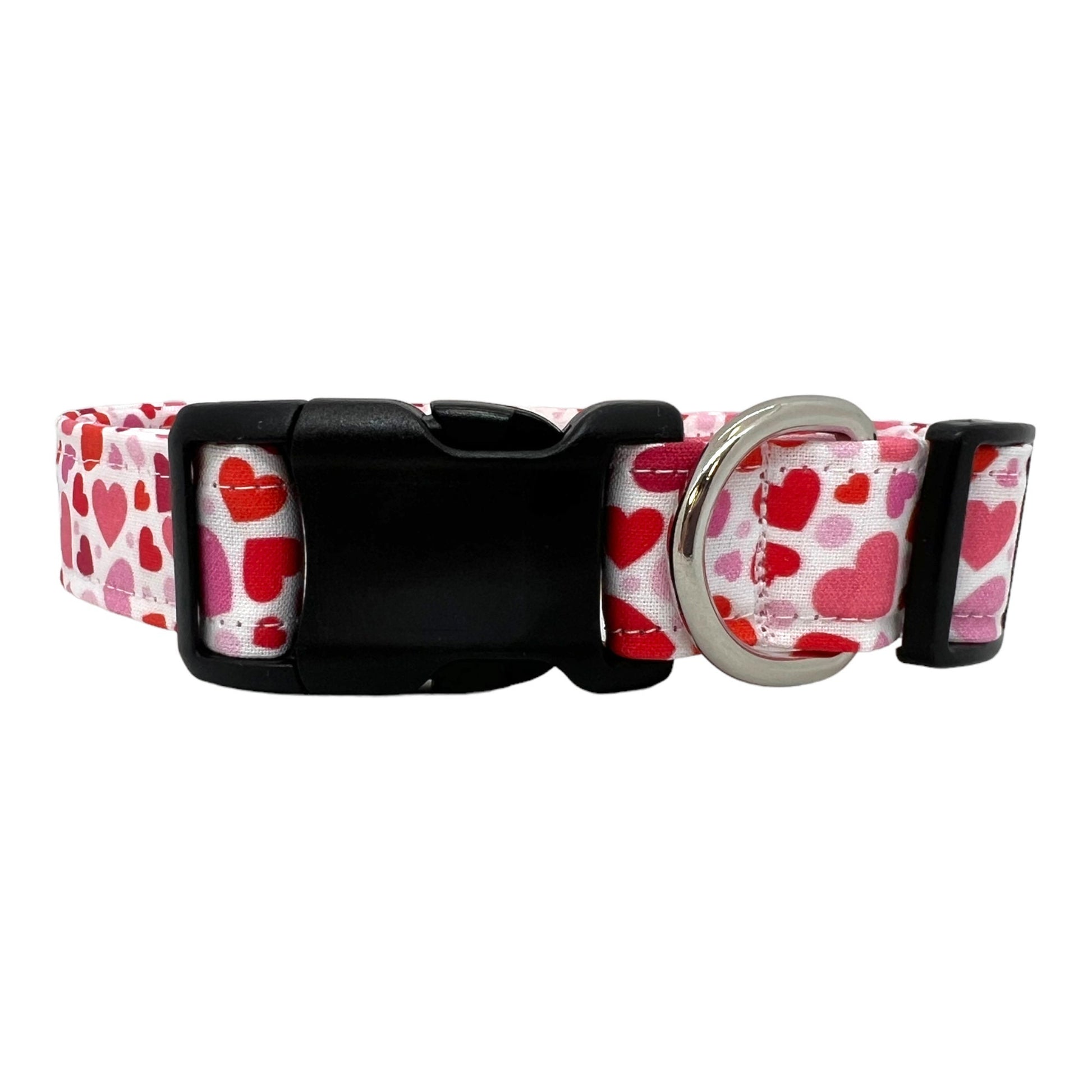 Valentine’s Day dog collar featuring red and pink hearts in various sizes, heart-themed pet collar shown flat.