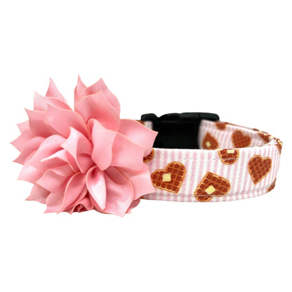 Valentine’s Day dog collar with waffle heart pattern on pink and white striped fabric with removable light pink dog collar flower embellishment.