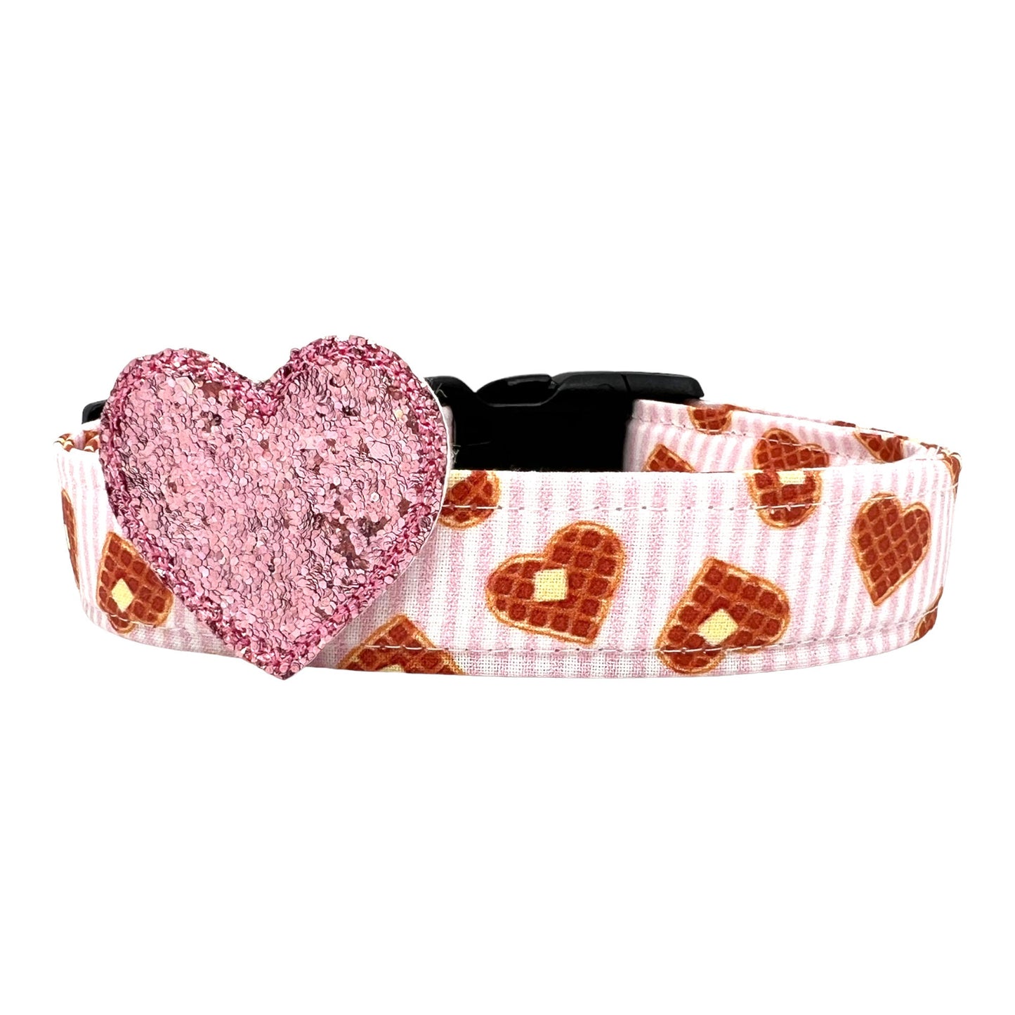 Dog collar with heart-shaped glittery pink heart and waffle pattern on a white background