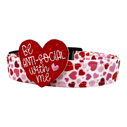 Valentine’s Day dog collar featuring red and pink hearts in various sizes, heart-themed pet collar shown flat with red heart dog collar embellishment.