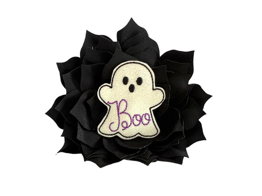Black dog collar flower with a shimmery white ghost label saying 'Boo' on a white background