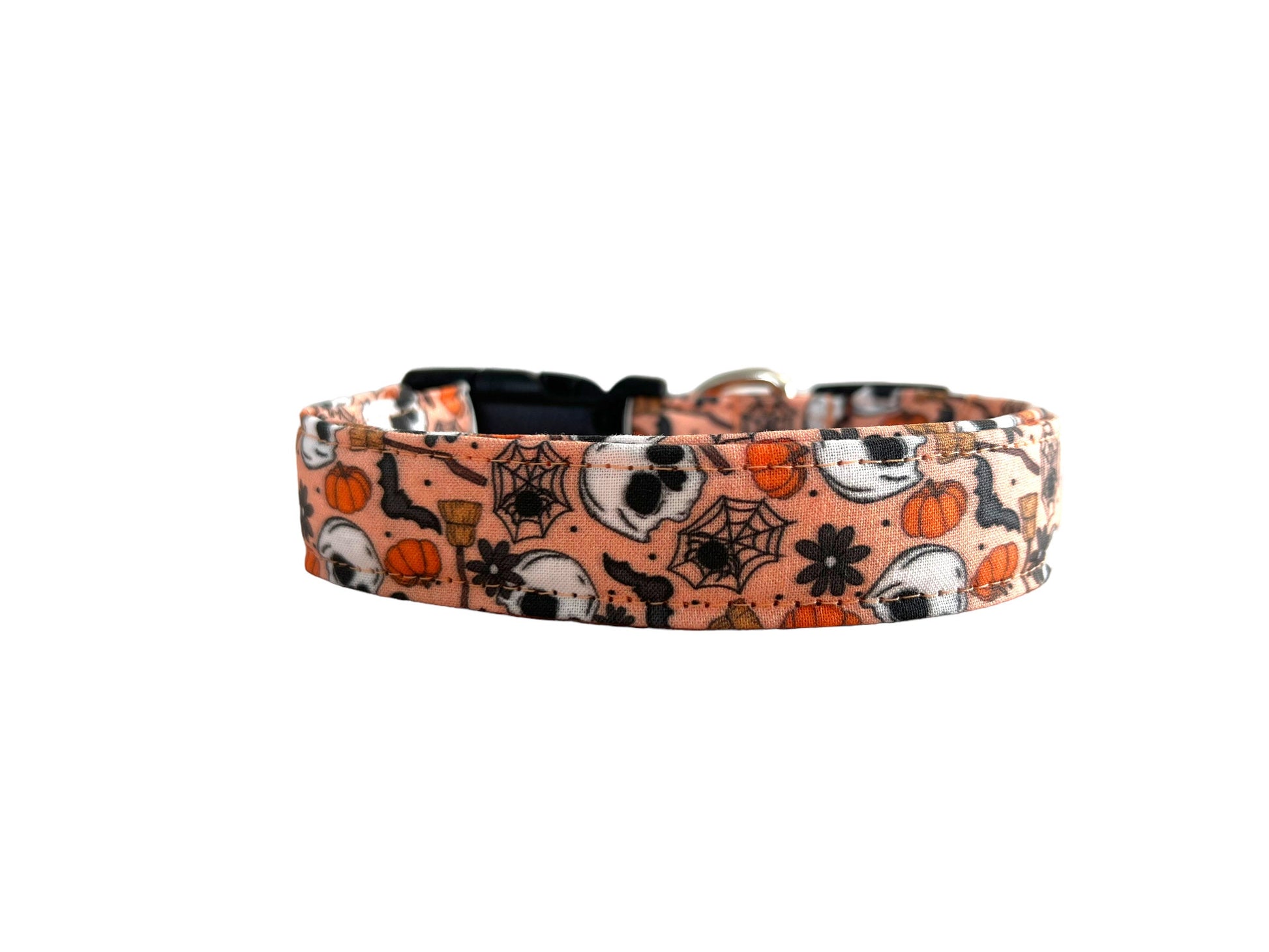 Halloween-themed dog collar with pumpkins, ghosts, and spiders on a white background