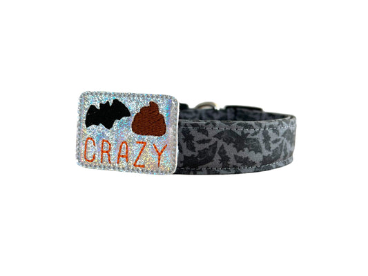 Gray Halloween dog collar with detailed bat pattern and matching black bat embellishment attached by an elastic loop.