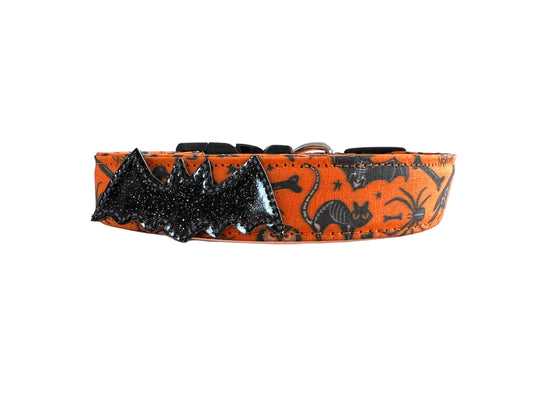 Halloween dog collar with x-ray designs of bats, owls, rats, ravens, and crossbones, shown with removable shimmery bat.