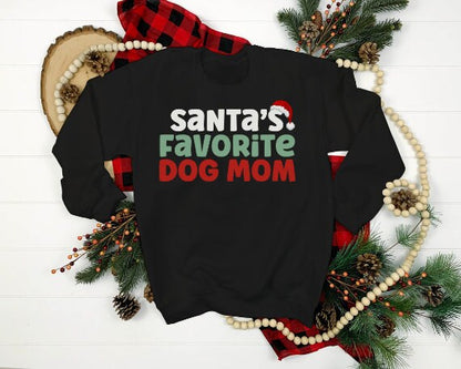 Black “Santa’s Favorite Dog Mom” sweatshirt with festive red and green holiday lettering, cozy unisex fit, and perfect for Christmas-loving dog moms.