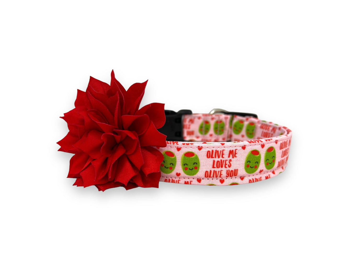Light pink Valentine’s Day dog collar with heart-shaped olive pattern, “Olive Me, Loves Olive You” text, and removable red flower embellishment.