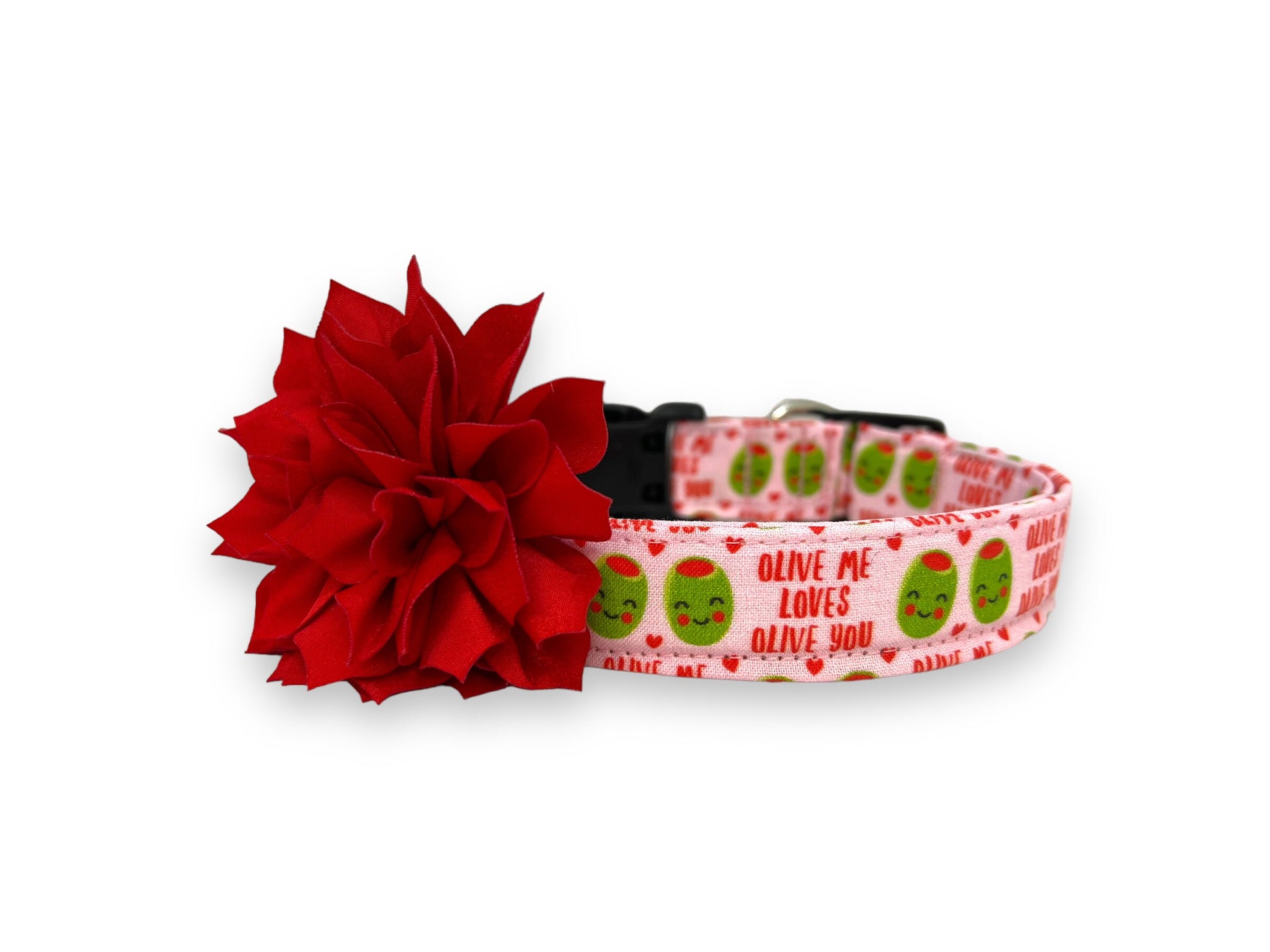 Light pink Valentine’s Day dog collar with heart-shaped olive pattern, “Olive Me, Loves Olive You” text, and removable red flower embellishment.