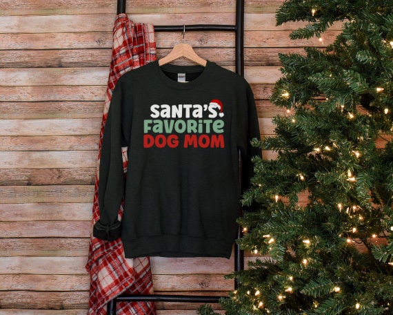 Dark Green “Santa’s Favorite Dog Mom” sweatshirt with festive red and green holiday lettering, cozy unisex fit, and perfect for Christmas-loving dog moms.