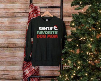 Dark Green “Santa’s Favorite Dog Mom” sweatshirt with festive red and green holiday lettering, cozy unisex fit, and perfect for Christmas-loving dog moms.