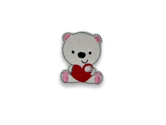 White shimmery polar bear dog collar embellishment holding a red heart, attaches with elastic loop