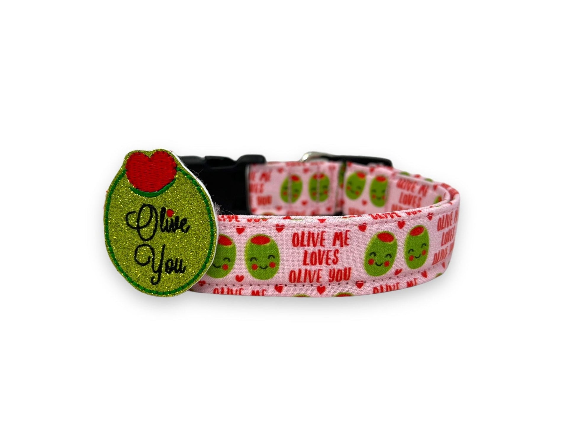 Light pink Valentine’s Day dog collar with heart-shaped olive pattern, “Olive Me, Loves Olive You” text, and removable "Olive You" olive embellishment.