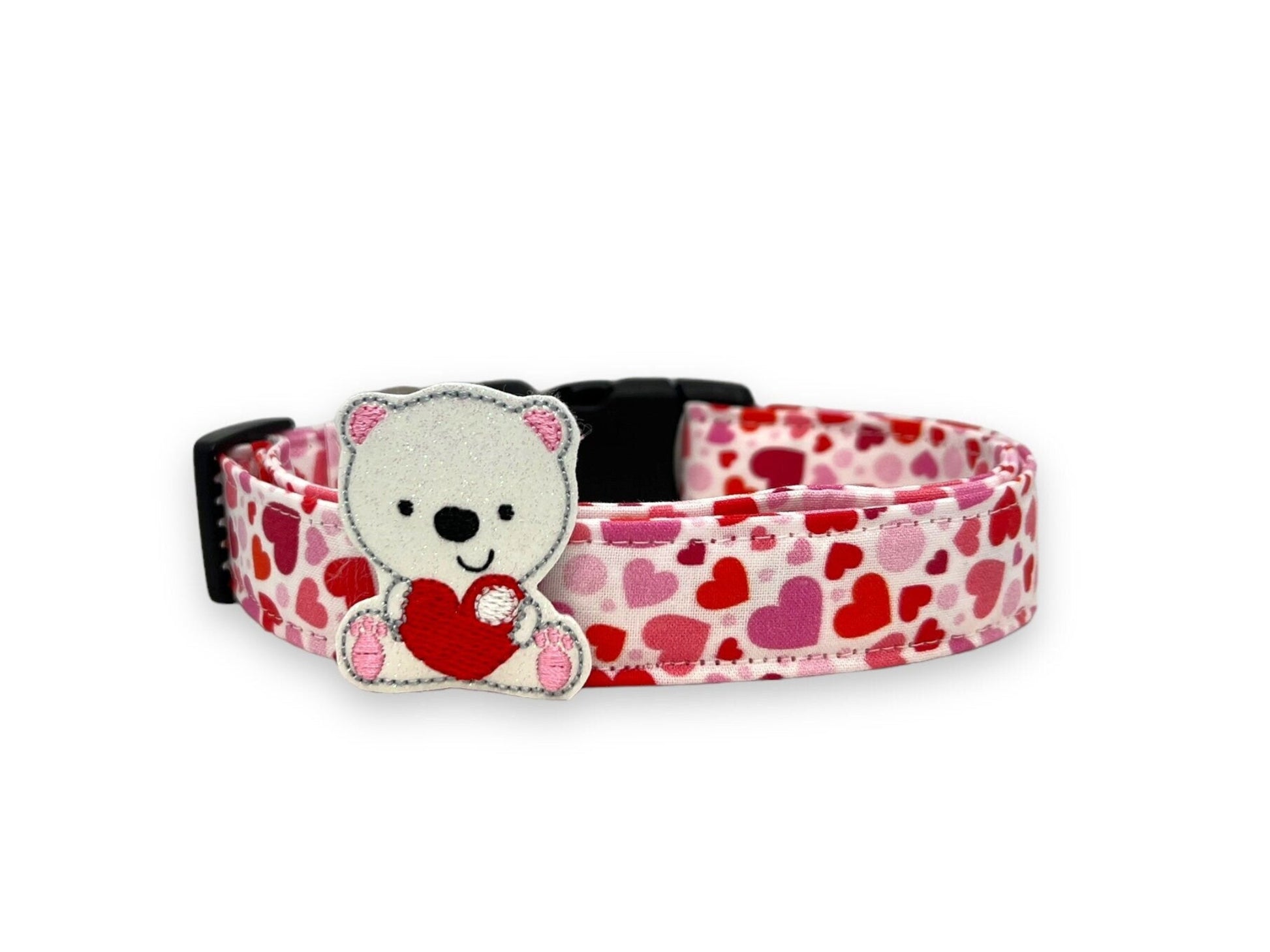 Valentine’s Day dog collar with pink and red heart pattern and removable polar bear embellishment attached with elastic loop