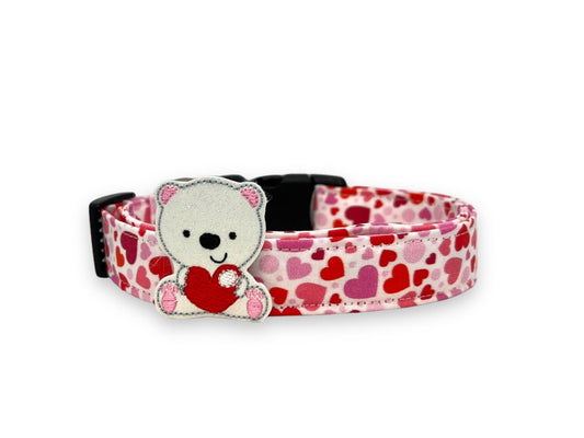 Valentine’s Day dog collar with pink and red heart pattern and removable polar bear embellishment attached with elastic loop