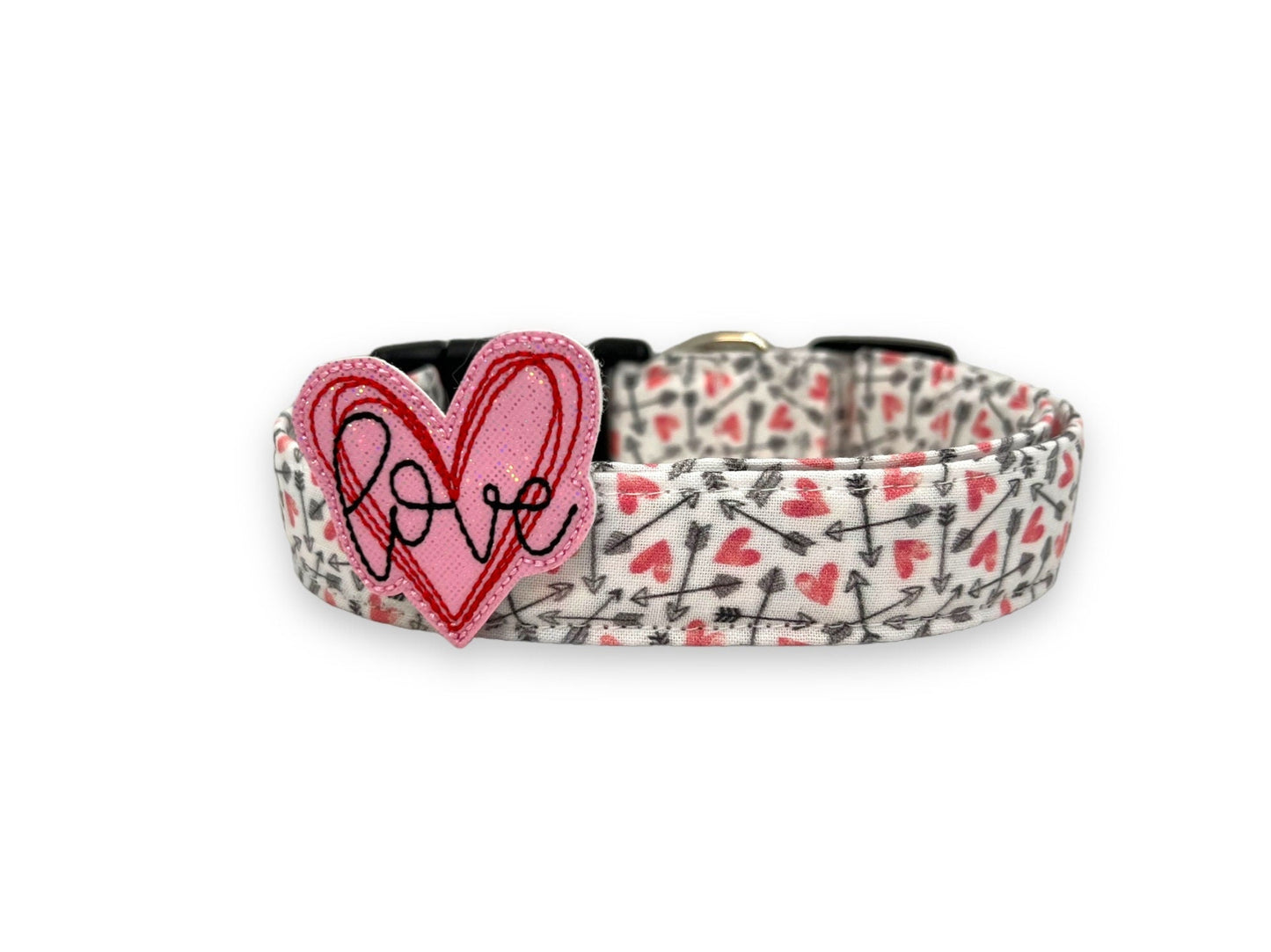 Valentine’s Day dog collar with pink hearts and black arrow pattern and removable pink “love” heart embellishment