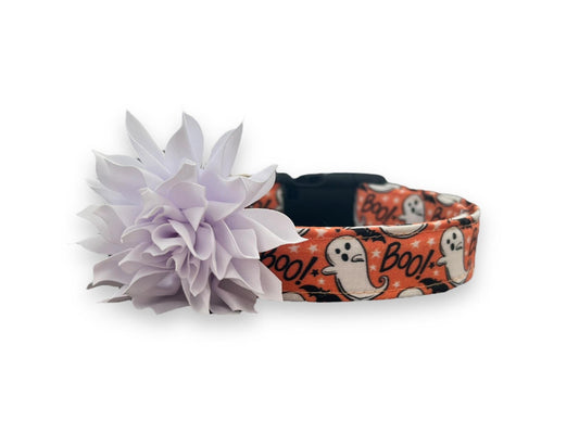 Orange Halloween dog collar with playful ghosts, black bats, “Boo!” text, and a detachable white flower embellishment.
