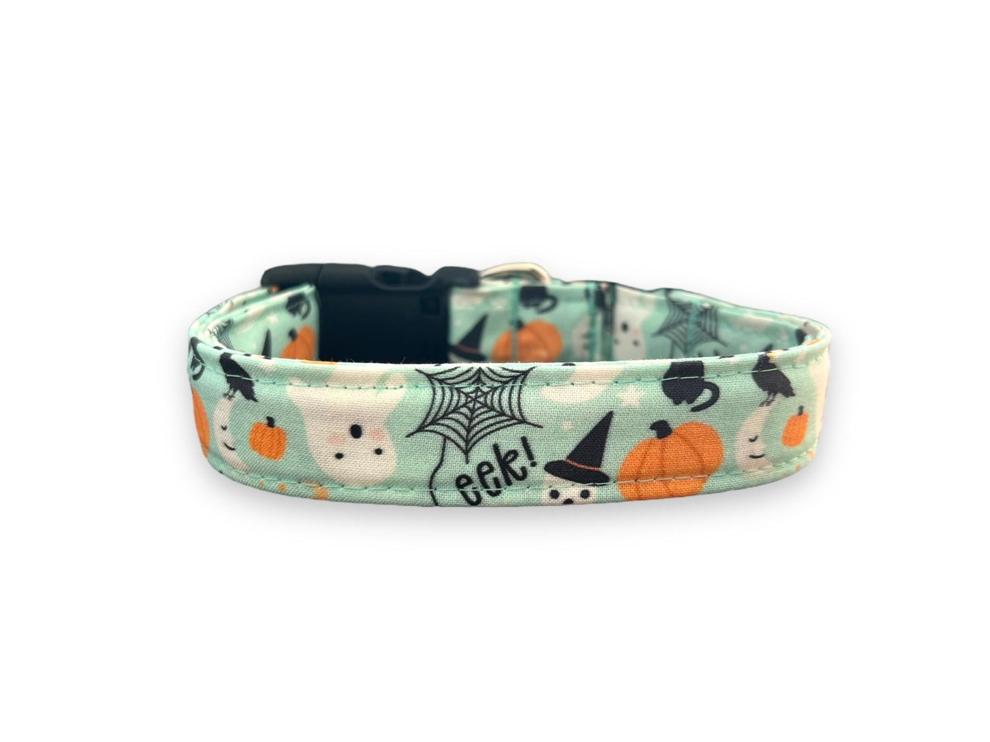 Halloween-themed dog collar with pumpkins, ghosts, and witches' hats on a light green background.