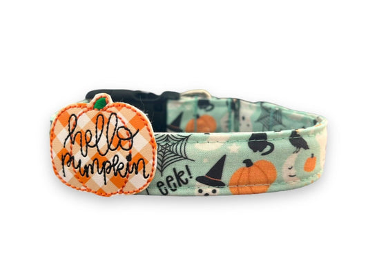 Pale sea glass Halloween dog collar with playful ghosts, pumpkins, spider webs, and a removable “Hello Pumpkin” embellishment for festive fall walks.