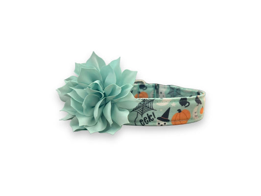 Halloween Boo Bash dog collar with a large mint green flower on a white background