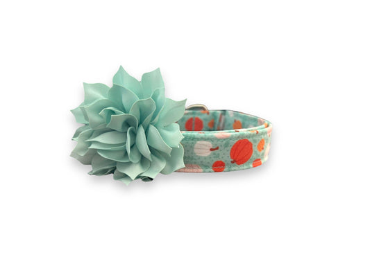Brighten up spooky season with this aqua Halloween dog collar featuring pink, white, and orange pumpkins. Includes a removable 3" or 4" flower in your choice of color.